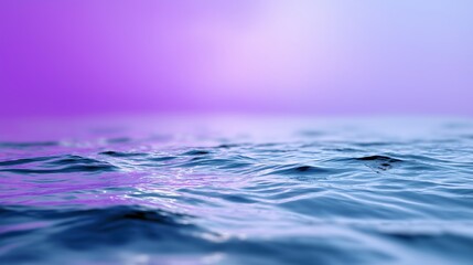 Tranquil ocean waves under vibrant purple sky at sunset