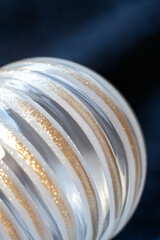 Glass ornament with hand-applied glass cane details
