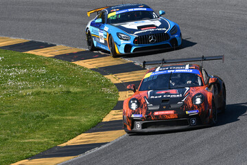 Naklejka premium Scarperia, Italy - March 20th 2025: Porsche 911 GT3 Cup (992) of Team Red Camel-Jordans.nl drive by Rik-Breukers-Danz in action during 12h Michelin at Mugello Circuit.