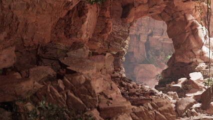 Wander through a stunning rocky cavern filled with vibrant greenery. Sunlight filters through craggy openings, illuminating scattered stones and the enchanting atmosphere of natures artistry.