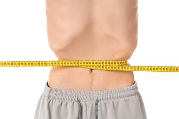 Young man with anorexia measuring his waist on white background, closeup
