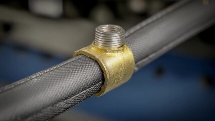 Side medium shot showcasing the final sealing process as heat shrink tubing conforms snugly ensuring waterproof protection on a wire joint.