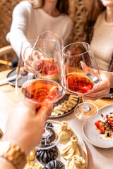 Friends toasting with wine over Georgian feast