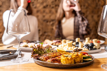 Friends enjoying Georgian dishes and wine together