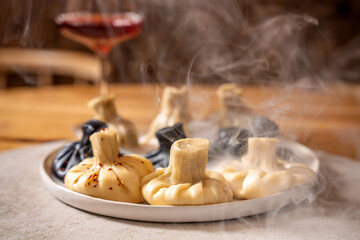 Steaming georgian khinkali dumplings on plate