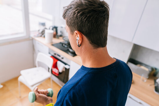 Healy young man enjoying morning with technology connected