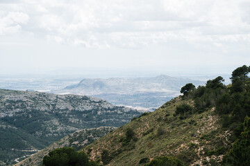 Scenic mountain landscape with cloudy sky and distant horizon