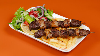 Delicious kebab plate isolated top view