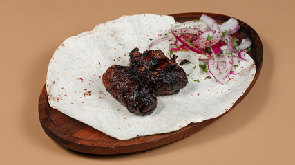Delicious kebab plate isolated top view