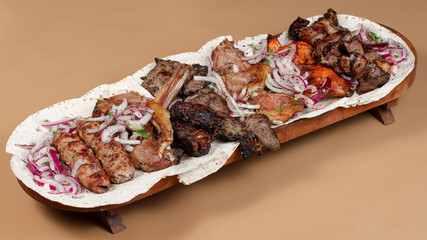Delicious kebab plate isolated top view