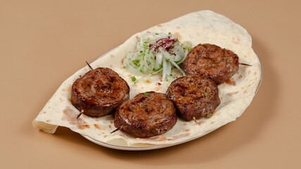 Delicious kebab plate isolated top view