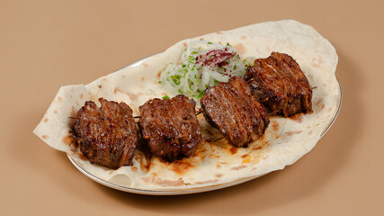 Delicious kebab plate isolated top view