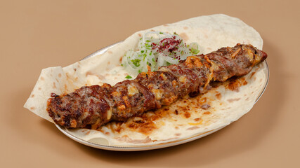 Delicious kebab plate isolated top view