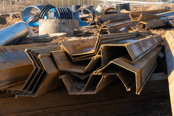 A close-up shot of several interlocking steel sheet piles