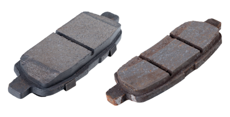 Passenger car brake pads on an isolated background. New and worn brake pads.