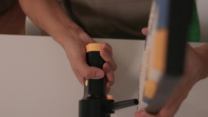 Closeup showing detailed cleaning of keyboard keys, Demonstration of meticulous keyboard cleaning involving dust removal and careful inspection in home environment