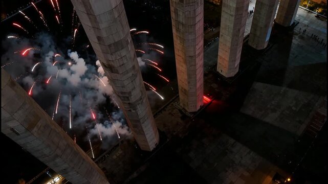 Spectacular Fireworks Display Illuminating Concrete Pillars During a Night Celebration
