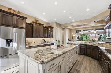 Modern Culinary Space With Bright Features, Elegant Kitchen Area With Ample Storage And Lighting