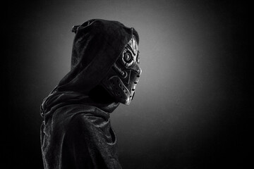 Robot android over dark misty background with clipping path