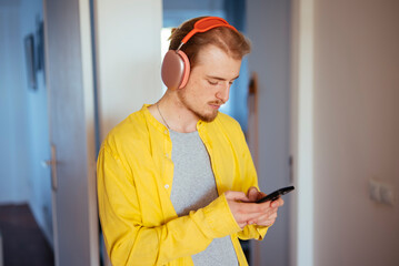 Content creator in casual wear reviewing mobile app content