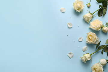 Beautiful white roses on blue background
