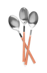 Silver spoons on white background