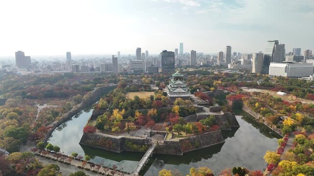 Osaka Castle, Chuo Ward, Osaka, Japan: 4K Aerial Drone Footage of Osaka Castle Park, Moat, Autumn Foliage, Historic Landmark, Japanese Architecture, City Skyline, Urban Landscape, O and Neya River