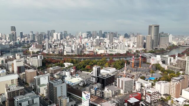 Osaka City CBD, Japan: 4K Drone Footage of Autumn Colours in Central Wards of Kita, Chuo, Miyakojima with Skylines along O and Neya River, Parks and Urban Landscape near Osaka Castle
