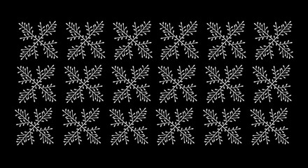 many white snowflakes on a black background