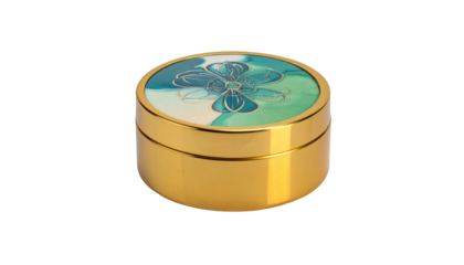 Gold round container with green floral patterned lid sits centered on a stark black background