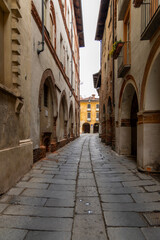 A suggestive glimpse of Via dei Portici in the heart of the Borgo del Piazzo in Biella.