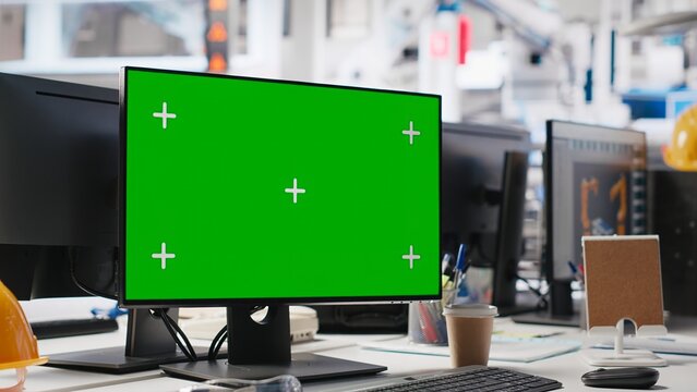 Green screen display on computer used to help in photovoltaics factory system parameters. Chroma key mockup pc used for optimizing energy supply in solar panel manufacturing plant, eco friendly.