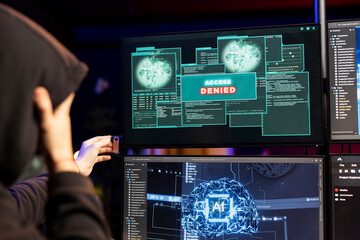 Hacker trying to steal confidential files getting access denied message on PC screen. Cybercriminal failing to exploit system flaws with AI software, getting rejected by cybersecurity