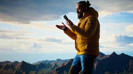 Careless hiker tries to make a phone call on the mountain top and falling off a cliff, causing the accident due to his obsession with technology and always staying connected. Camera A.
