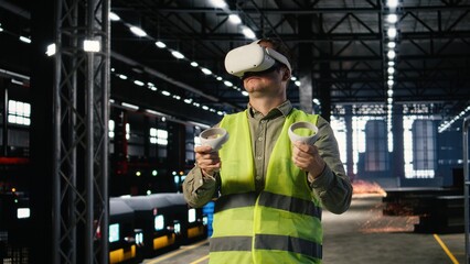 Industrial worker with VR glasses interacting with virtual reality simulation used for engineering development, surrounded by metal machinery and fabrication tools in industry plant.