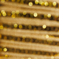 gold abstract bokeh background with soft shimmering circles and warm light blur