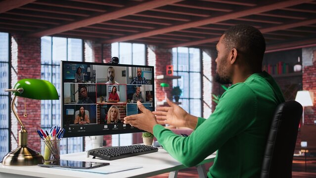 Manager talking to employees during web video call at home, analyzing business documents, organizing job tasks. Supervisor doing remote teleconference meeting with staff members. Camera B. - Powered by Adobe