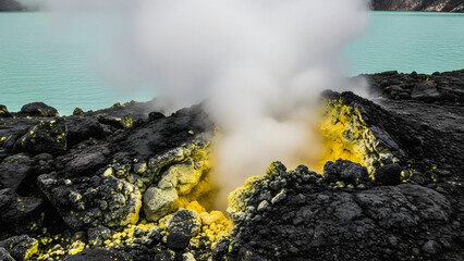 Tropical Crater Lake scientific research concept with geologist hand holding water sample vial