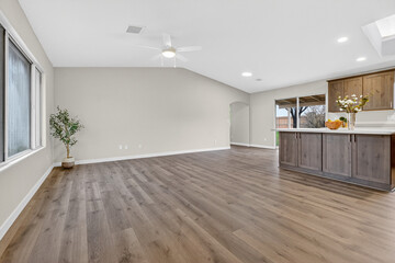 Obraz premium Open Living Space Featuring Island And Bar, Bright Airy Living Room With Views And Functional Design