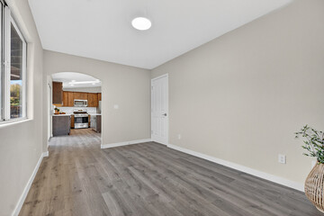 Expansive Transitional Space Featuring Large Window And Inviting Ambiance For Social Events