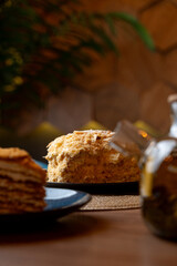 A delightful display of indulgent layered cake next to a jar of golden honey, inviting warmth fills the space as soft light enhances the flavors in this cozy cafe scene