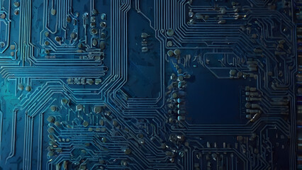 Intricate blue circuit board close-up revealing complex electronic pathways and microchip components, symbolizing advanced technology and digital data processing