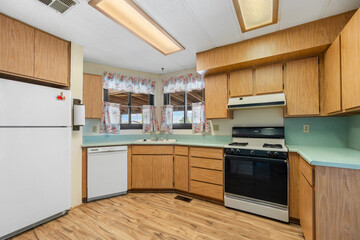 A beautifully designed kitchen with wooden cabinets and a white fridge