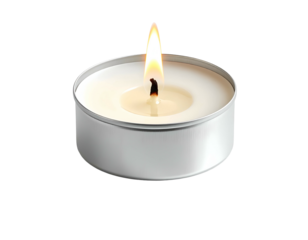 Burning white tea light in silver metal holder on black backdrop