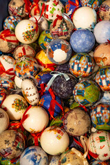 Winter holiday decorations: lots of Christmas tree baubles to create a festive atmosphere. Christmas baubles background.