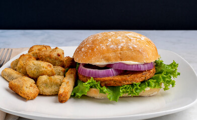 veggie burger  with veggie tots and fries