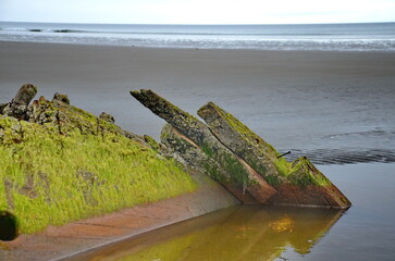 Small fishing boat shipwreck on the North beach-Rose Spit near Massett on Haida Gwaii, BC, Canada.