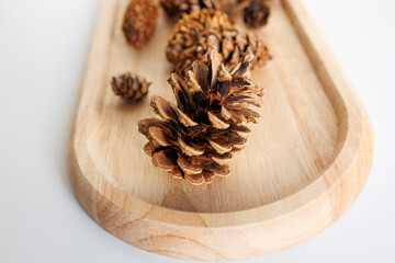 pine cones on wooden tray for natural winter decor