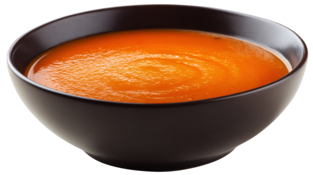 Fresh creamy tomato soup in dark bowl on transparent background for food design and menu presentation