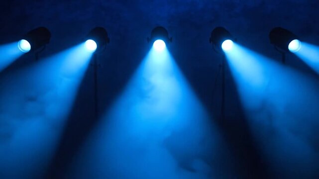 Five Electric Blue Spotlights on Indigo Background. Horizontal Row of Cone Shaped Beams. Graphic Abstract Futuristic Anticipation.